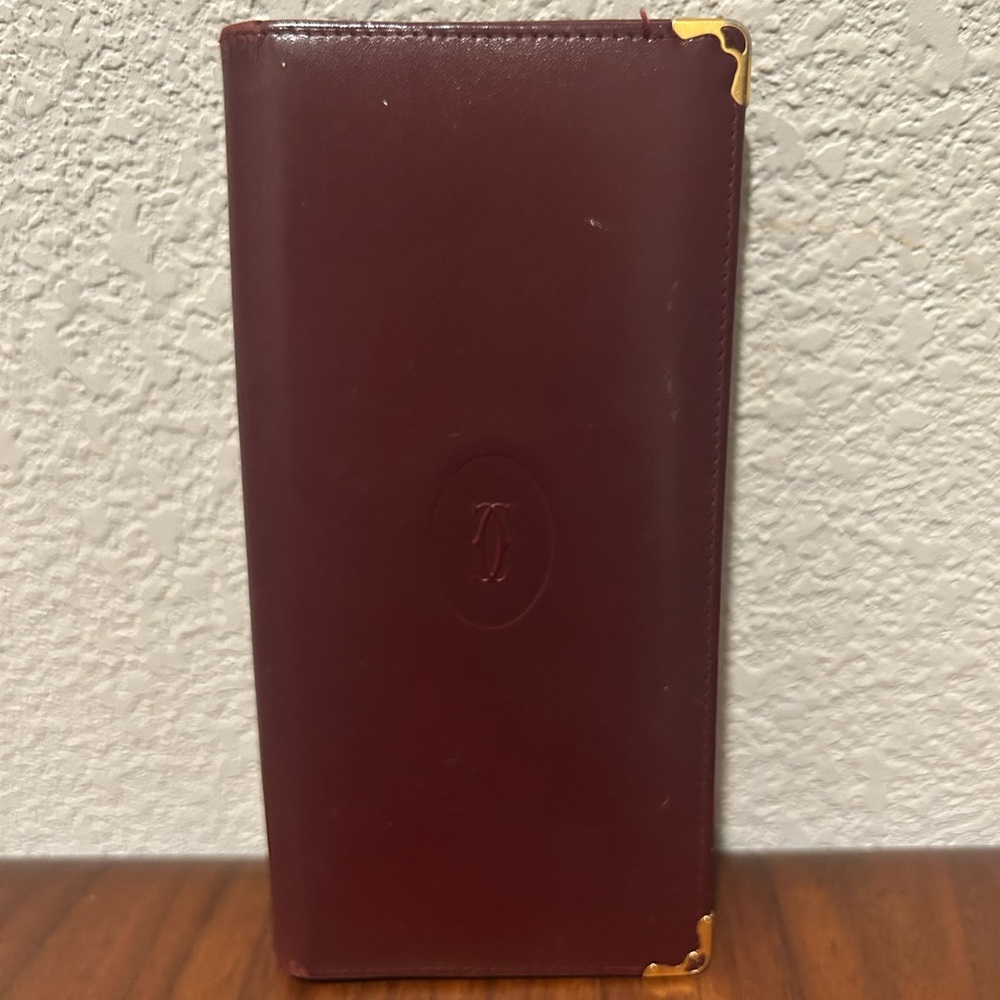Cartier burgundy leather long wallet with gold accents
